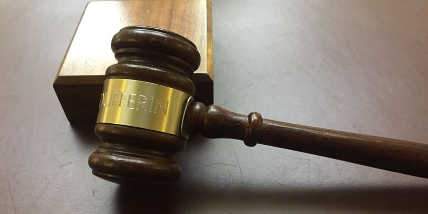 brown wooden gavel with a gold band that says Dufferin