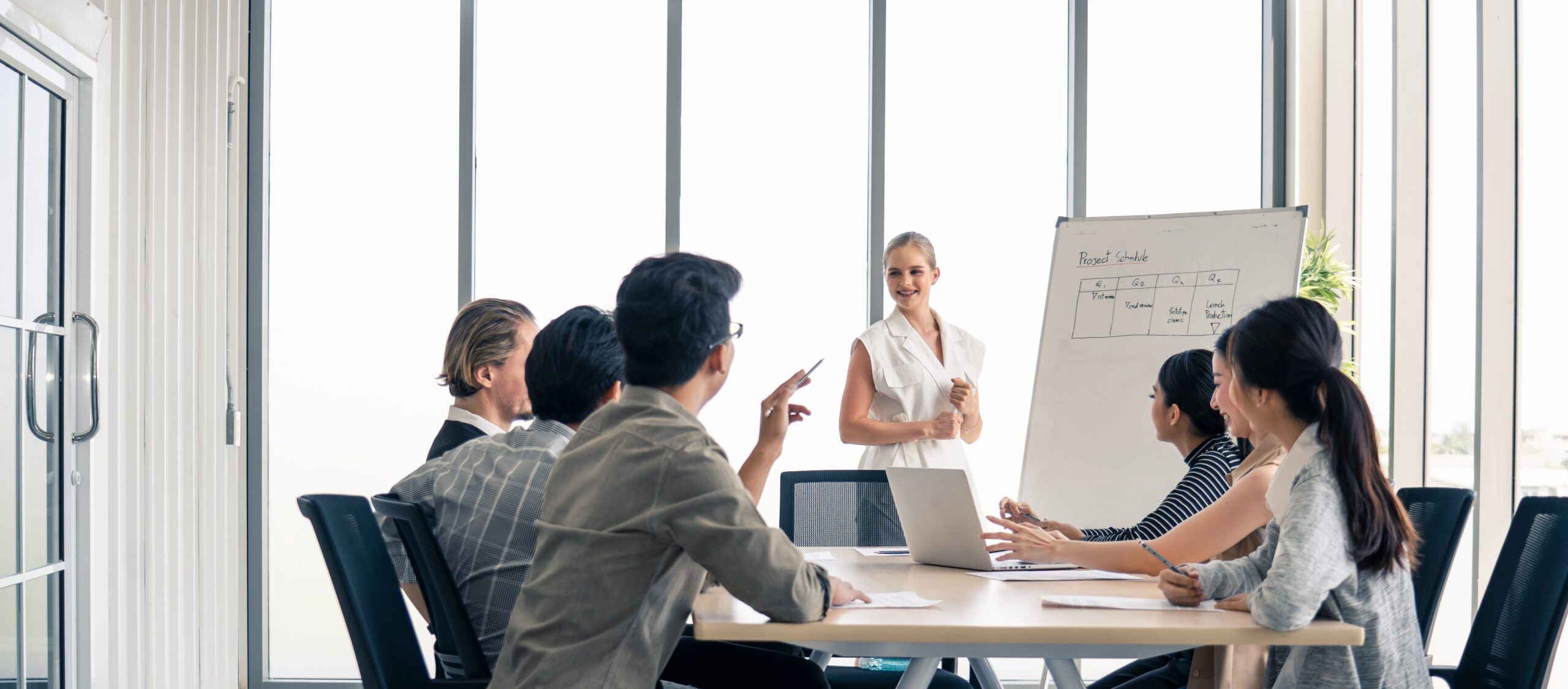 Woman leader working brainstorm to solve problem with team, presentation new idea. People discuss and smile on new challenge topic in meeting room. Business finance and communication planning concept.